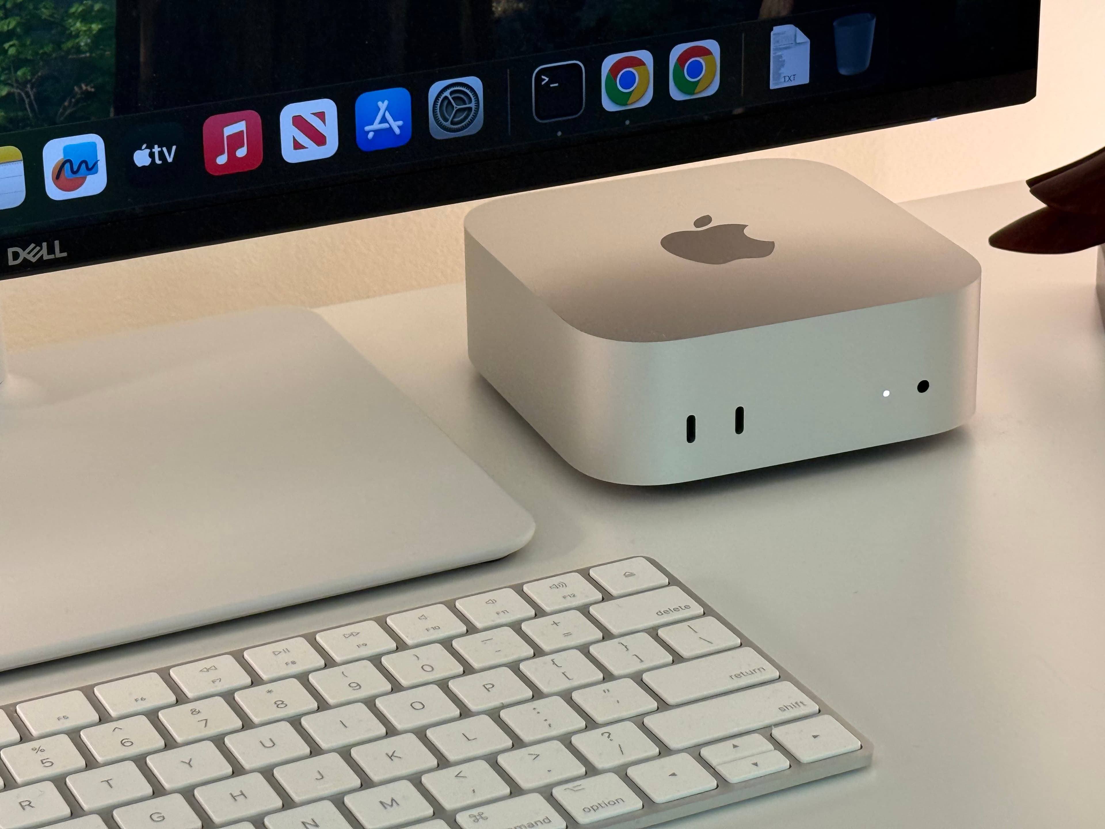 Mac Mini cluster at the Maai Services workstation — the hardware that runs the autonomous systems
